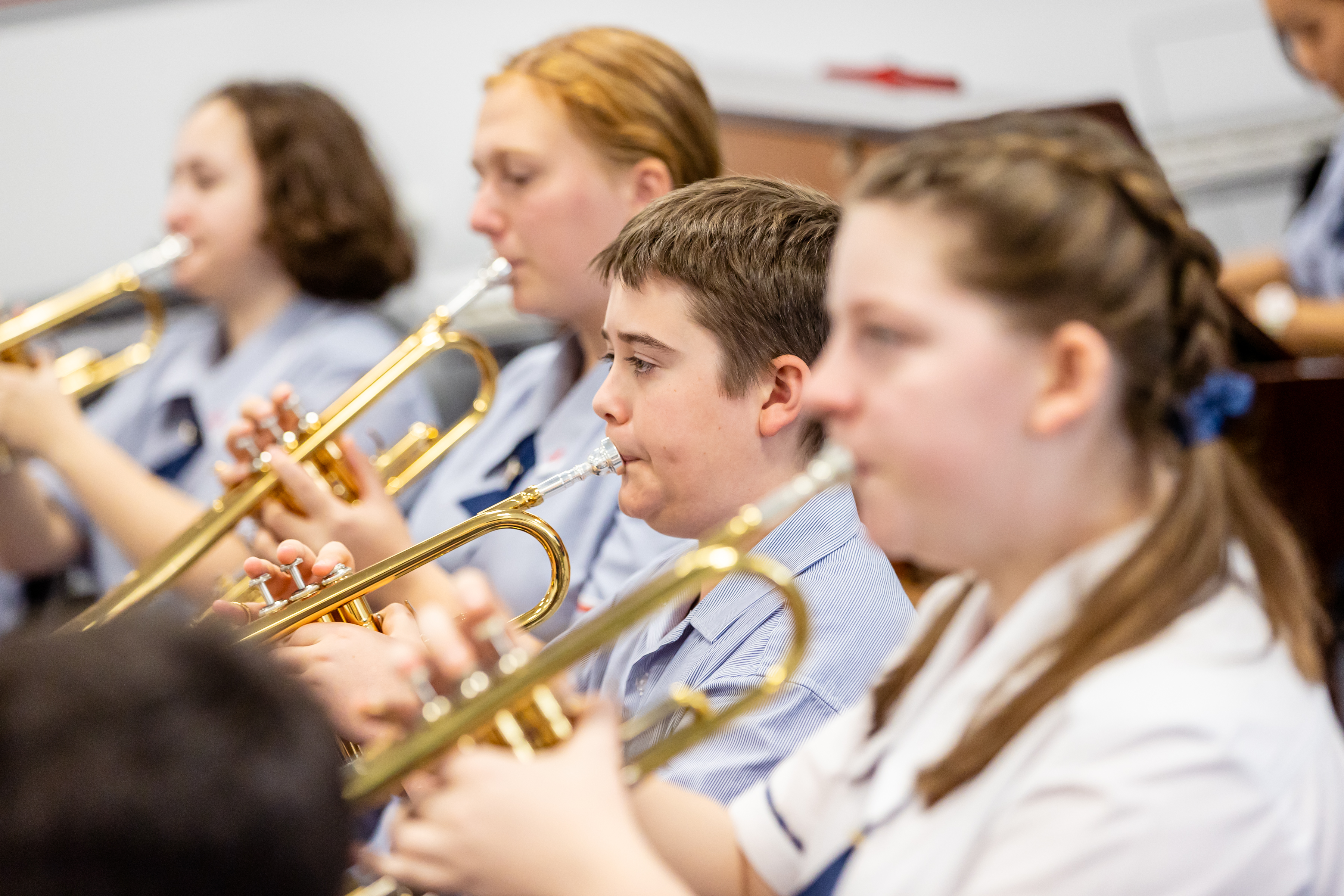 Students playing the trumpet
